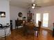 Charming dining room featuring wood flooring, a ceiling fan, and a buffet cabinet at 391 Newbury Ct, Henderson, NV 89015