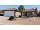 Charming single-story home with a tile roof, desert landscaping, and mature shade tree at 391 Newbury Ct, Henderson, NV 89015