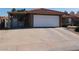 Single Gathering home with a spacious driveway, garage, carport, and well-maintained landscaping at 391 Newbury Ct, Henderson, NV 89015