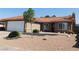 Charming home features a low-maintenance front yard, red tile roof, and two-car garage at 391 Newbury Ct, Henderson, NV 89015