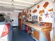 Garage with wooden art pieces hanging on the wall and a workbench at 391 Newbury Ct, Henderson, NV 89015