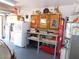 Garage featuring storage cabinets, a refrigerator, and a work bench at 391 Newbury Ct, Henderson, NV 89015