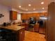 Bright kitchen featuring stainless steel appliances, granite countertops, and wooden cabinets at 391 Newbury Ct, Henderson, NV 89015