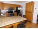 Cozy kitchen with granite countertops, stainless steel appliances, and wooden cabinets at 391 Newbury Ct, Henderson, NV 89015
