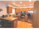 Updated kitchen features granite countertops, stainless steel appliances, and a breakfast bar at 391 Newbury Ct, Henderson, NV 89015