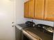 Laundry room with cabinets, a gray washer, and a matching dryer at 391 Newbury Ct, Henderson, NV 89015