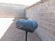 A charcoal grill in the backyard is ready for outdoor cookouts against a block wall backdrop at 391 Newbury Ct, Henderson, NV 89015