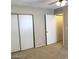 Bedroom with large closet, ceiling fan, carpet, and adjacent bathroom at 4021 Broadriver Dr, Las Vegas, NV 89108