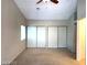 Bedroom features a ceiling fan, large closet space, and natural light at 4021 Broadriver Dr, Las Vegas, NV 89108