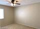 Cozy bedroom features a ceiling fan, carpet, and a window for natural light at 4021 Broadriver Dr, Las Vegas, NV 89108