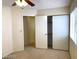 Bedroom featuring a ceiling fan, closet and an open entry to another room at 4021 Broadriver Dr, Las Vegas, NV 89108