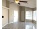 Spacious living room with tile floors, bright natural light, and neutral paint colors at 4021 Broadriver Dr, Las Vegas, NV 89108