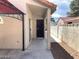 Back yard featuring a walk way, a closed door and partial pergola at 4021 Broadriver Dr, Las Vegas, NV 89108