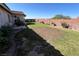 Well-maintained backyard with lush green grass and landscaped borders at 416 Richgold St, Henderson, NV 89012