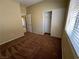 Bedroom features carpet, a window with blinds, and a double-door closet at 416 Richgold St, Henderson, NV 89012