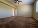 Bedroom features carpet, a ceiling fan, a window, and neutral paint at 416 Richgold St, Henderson, NV 89012