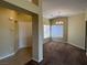 Open concept living and dining area with neutral tones and large windows for natural light at 416 Richgold St, Henderson, NV 89012