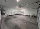 Bright two-car garage featuring built-in shelving for organization at 416 Richgold St, Henderson, NV 89012