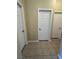 Hallway featuring tile flooring and white paneled doors at 416 Richgold St, Henderson, NV 89012