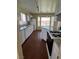 Bright kitchen with white cabinets, wood floors, granite countertops, and bay window breakfast nook at 416 Richgold St, Henderson, NV 89012