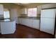 Bright kitchen featuring white cabinets, granite countertops, and stainless steel appliances at 416 Richgold St, Henderson, NV 89012