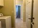 Convenient laundry area with a washing machine and hallway access at 416 Richgold St, Henderson, NV 89012