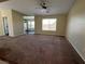 Cozy living room with plush carpeting and natural light at 416 Richgold St, Henderson, NV 89012