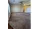 Spacious living room featuring plush carpeting and a ceiling fan at 416 Richgold St, Henderson, NV 89012