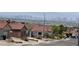 View of a quiet neighborhood with desert landscaping with city view at 416 Richgold St, Henderson, NV 89012