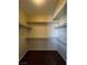 Spacious walk-in closet with carpet and ample shelving provides plenty of room for storage and organization at 416 Richgold St, Henderson, NV 89012