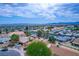 Expansive aerial view showcasing the property's location with city and mountain views beyond at 4161 Royalhill Ave, Las Vegas, NV 89121