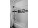 Stylish bathroom featuring a tiled shower with modern fixtures and a built-in shelf at 4161 Royalhill Ave, Las Vegas, NV 89121