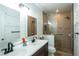 Modern bathroom with double vanity, glass shower, and stylish tile work at 4161 Royalhill Ave, Las Vegas, NV 89121
