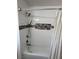 Bathroom with tiled shower, modern fixtures, and a built-in shelf at 4161 Royalhill Ave, Las Vegas, NV 89121