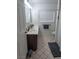 Bright bathroom showcasing a double vanity, tiled floors, and a neutral color palette at 4161 Royalhill Ave, Las Vegas, NV 89121