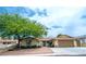 Charming single-story home featuring mature landscaping and a two-car garage at 4161 Royalhill Ave, Las Vegas, NV 89121