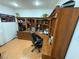 Home office includes custom shelving and hardwood floors at 4161 Royalhill Ave, Las Vegas, NV 89121