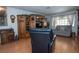 Spacious living room with a large entertainment center, cozy seating, and natural light at 4161 Royalhill Ave, Las Vegas, NV 89121