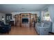 Bright and open living room with an entertainment center, cozy seating, and a view to the backyard at 4161 Royalhill Ave, Las Vegas, NV 89121
