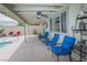 Inviting covered patio with a ceiling fan, poolside seating, and BBQ, perfect for outdoor enjoyment at 4161 Royalhill Ave, Las Vegas, NV 89121