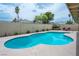 The backyard has a pristine pool and serene landscaping, perfect for enjoying outdoor living at 4161 Royalhill Ave, Las Vegas, NV 89121