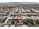 Aerial view of a home with solar panels in a neighborhood near mountains at 4216 Thunder Twice St, Las Vegas, NV 89129