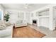 Cozy living room features wood and tile flooring, a fireplace, and neutral paint, creating a warm atmosphere at 4216 Thunder Twice St, Las Vegas, NV 89129