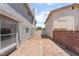 Property with brick patio and desert landscaping at 4657 Curdsen Way, Las Vegas, NV 89110