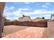 Spacious backyard with brick paver patio and rock landscaping at 4657 Curdsen Way, Las Vegas, NV 89110