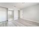 Bedroom with a mirrored closet and gray luxury vinyl plank flooring at 4657 Curdsen Way, Las Vegas, NV 89110