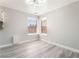 The dining area features wood-look floors and large windows for natural light at 4657 Curdsen Way, Las Vegas, NV 89110
