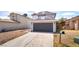 Two-story home featuring a gray exterior and a two-car garage at 4657 Curdsen Way, Las Vegas, NV 89110