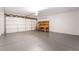 Attached two-car garage with workbench and shelving at 4657 Curdsen Way, Las Vegas, NV 89110