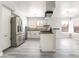 Bright kitchen with stainless steel appliances, stylish backsplash, and white cabinetry at 4657 Curdsen Way, Las Vegas, NV 89110